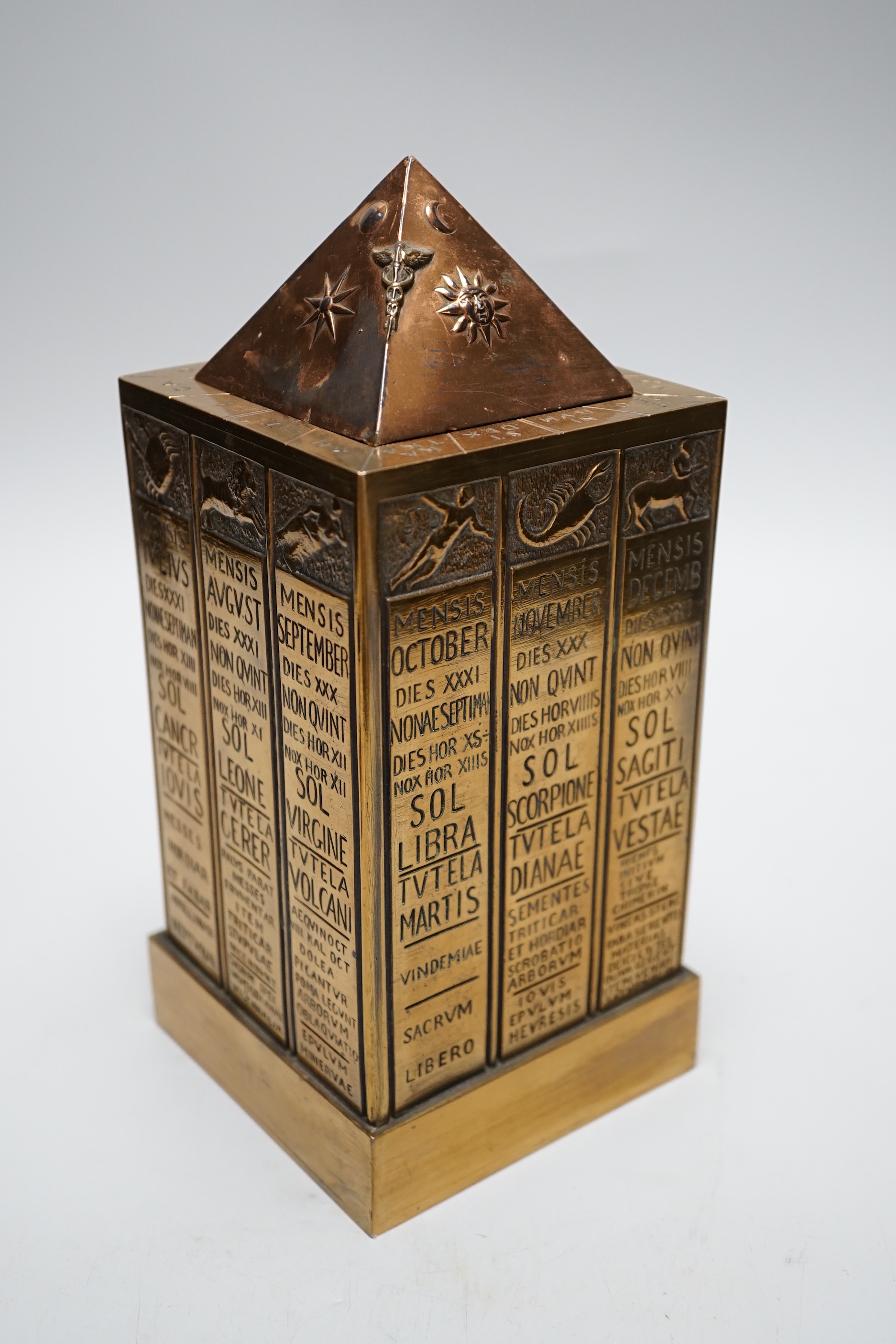 A German astrological cast stand together with a Masonic ceremony book, tallest 23cm